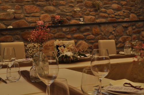 a table with wine glasses on top of it at Hotel Calzada in Arcos
