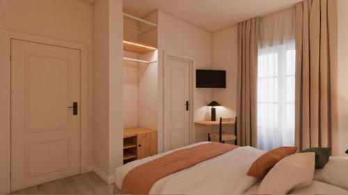 um quarto branco com uma cama e uma janela em BYPILLOW Casa Gades em Cádiz