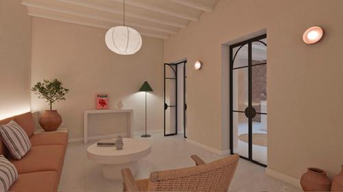 uma sala de estar com um sofá e uma mesa em BYPILLOW Casa Gades em Cádiz