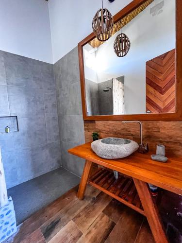 a bathroom with a sink and a mirror at DIEM Vichayito Beachfront Eco-Luxury in Vichayito