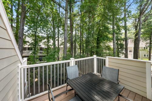 a deck with a wooden table and two chairs at Sea Colony---1805 Doubles Court in Bethany Beach