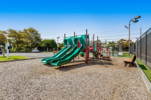 a playground with a slide in a park at Sea Colony---1805 Doubles Court in Bethany Beach