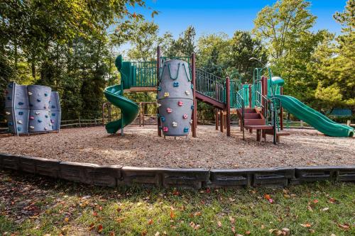 a playground with a slide in a park at Sea Colony---1805 Doubles Court in Bethany Beach