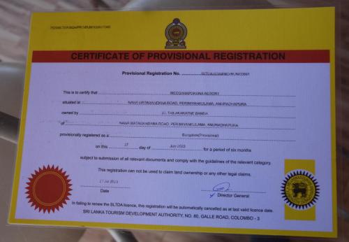 a certificate of provisional registration on a yellow and white paper at Meegahapokuna Resort in Anuradhapura