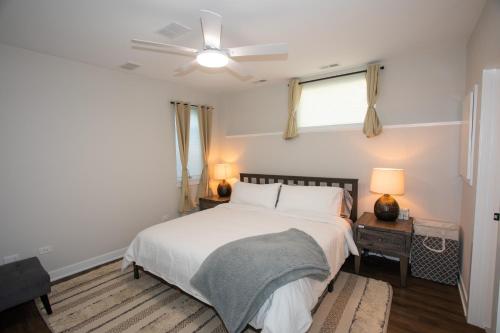 a bedroom with a bed and a ceiling fan at Brand new townhome in Downtown Naperville Family and Commute-friendly The May 3.5 in Naperville