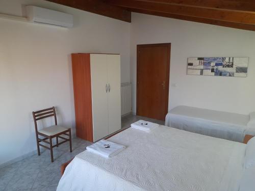 Postel nebo postele na pokoji v ubytování B&B da Marianna