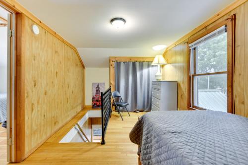 a bedroom with a large bed and a window at Point Breeze Vacation Rental, Walk to Lake Ontario in Waterport