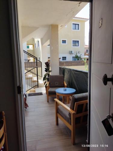 a view of a balcony with a couch and a table at Vicky apartment in Paralimni