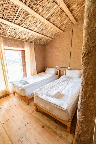 Voodi või voodid majutusasutuse KyzArt Hotel & Horse Tours toas