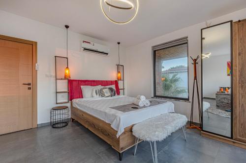 a bedroom with a large bed and a window at Private & Secluded Luxury Villa Casa Pura Vida in Belek