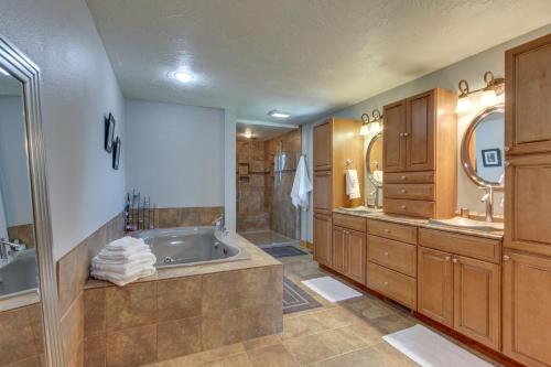 a large bathroom with a tub and a shower at Mountain-View Rental with Hot Tub - 9 Mi to Helena! in Clancy