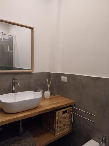 a bathroom with a white sink and a mirror at BBCasablu in Acireale