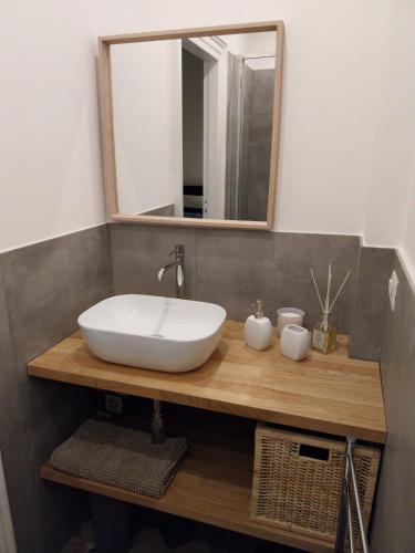 a bathroom with a sink and a mirror at BBCasablu in Acireale