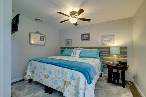 a bedroom with a bed and a ceiling fan at Coastal Getaway with Porch, 2 Mi to Niantic Beach! in Niantic