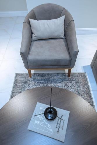 a living room with a couch and a coffee table at Knightsbridge Hotel & Suites in Abuja