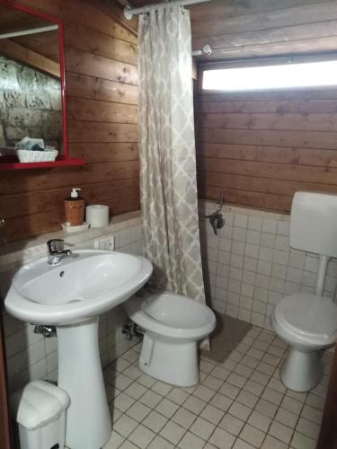 a bathroom with a sink and a toilet at Raggio Di Sole in Alberobello
