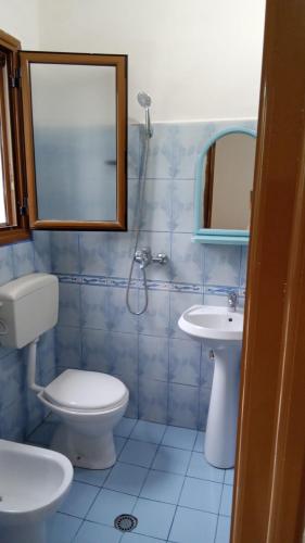 a bathroom with a toilet and a sink at Home to rent-Casa vacanza-Shtepi pushimesh-KONDAJ in Orikum