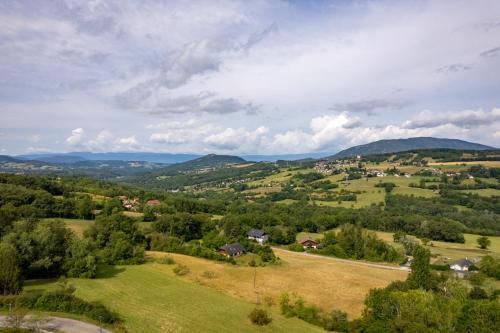 an aerial view of a green valley with mountains at Domaine du Chypre in Cercier