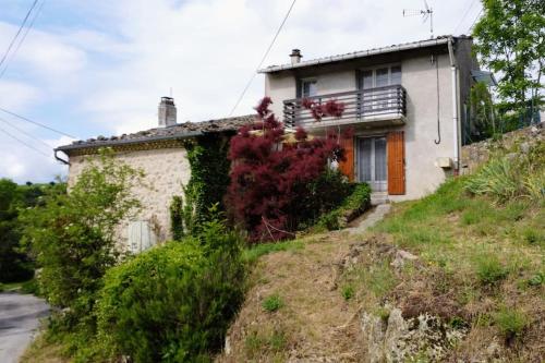 a house on the side of a hill at Gîtes Les Sorbes in champis