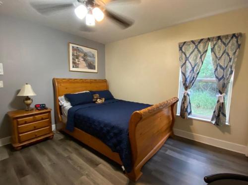 a bedroom with a bed and a window at A Treasure Coast Gem- Private entrance and private bathroom in Port Saint Lucie