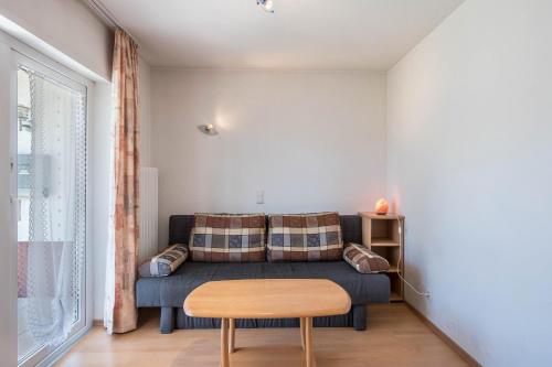 a living room with a couch and a table at Haus Isele in Urberg