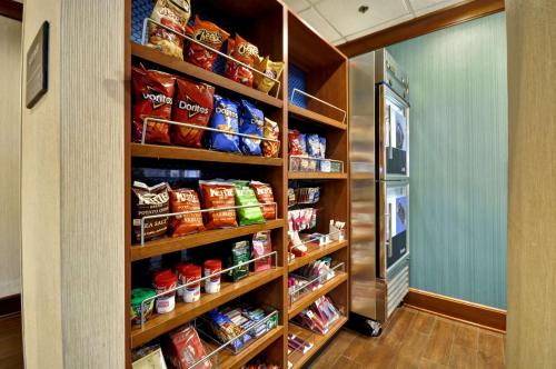 a pantry filled with lots of food and a refrigerator at Hampton Inn Chicago-Gurnee in Gurnee