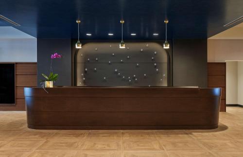 a lobby with a reception desk in a building at Sable At Navy Pier Chicago, Curio Collection By Hilton in Chicago