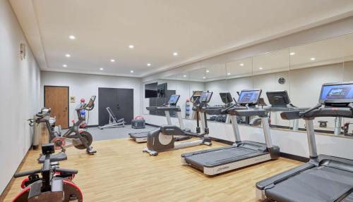 a gym with several treadmills and cardio machines at Sable At Navy Pier Chicago, Curio Collection By Hilton in Chicago