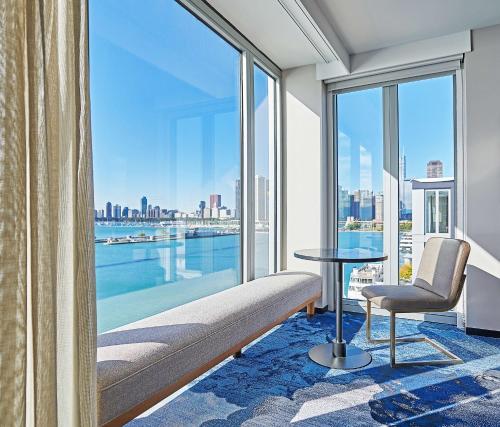 a hotel room with a view of the water at Sable At Navy Pier Chicago, Curio Collection By Hilton in Chicago