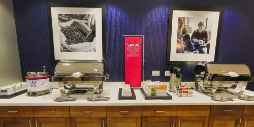 a counter top with two hair dryers in a salon at Hampton Inn & Suites Charlotte/Ballantyne, Nc in Charlotte