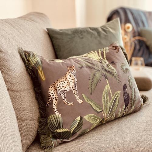 a pillow with a cheetah on it on a couch at Neues Glück Seligenstadt in Seligenstadt