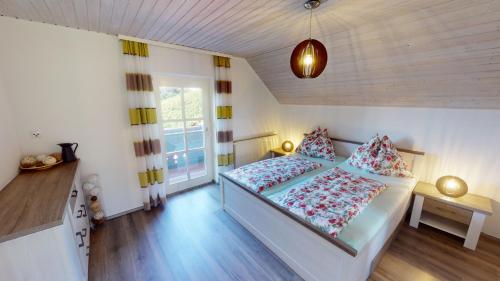 a small bedroom with a bed and a window at Ferienwohnung Kleissner in Großklein