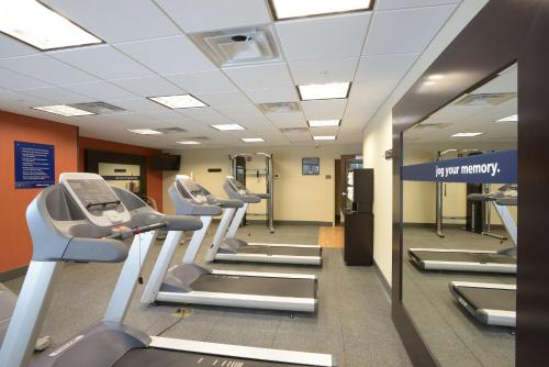 a gym with rows of treadmills and machines at Hampton Inn & Suites - Cincinnati/Kenwood, OH in Cincinnati