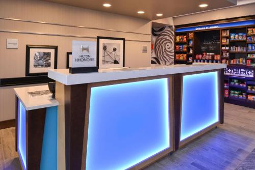 a counter in a store with blue lights at Hampton Inn & Suites Cincinnati-Mason, Ohio in Mason