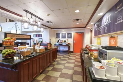 a restaurant with a buffet line with food at Hampton Inn & Suites Cincinnati-Union Centre in West Chester