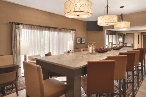 a large dining room with a long table and chairs at Hampton Inn Cincinnati Kings Island in Mason