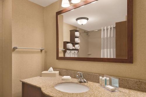 a bathroom with a sink and a mirror at Hampton Inn Cincinnati Kings Island in Mason