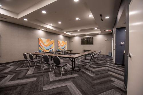 a conference room with a long table and chairs at Tru By Hilton Allen Dallas, Tx in Allen