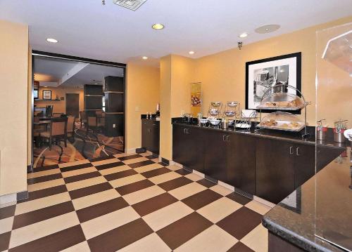 a kitchen with a checkered floor and a counter at Hampton Inn Eden in Eden