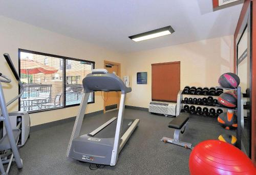 a room with a gym with a treadmill and weights at Hampton Inn Eden in Eden