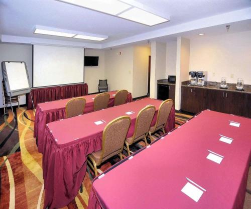 a conference room with pink tables and chairs at Hampton Inn Eden in Eden