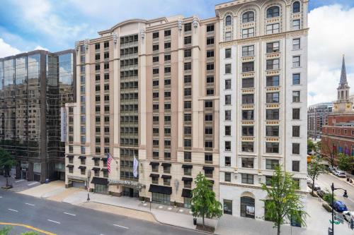 a large white building on a city street at Hilton Garden Inn Washington DC Downtown in Washington