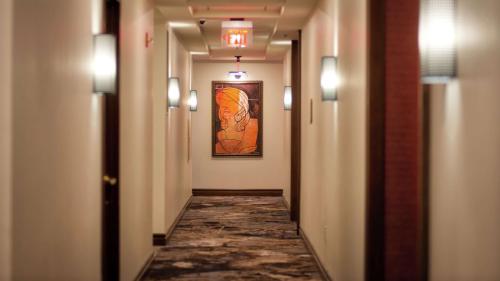 a hallway with a painting on the wall and a painting on the wall at Canopy by Hilton Washington DC Embassy Row in Washington