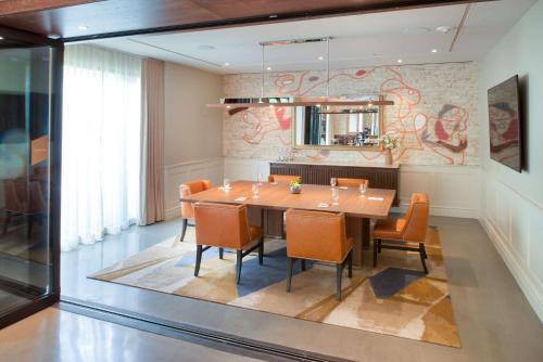 a dining room with a table and chairs at Canopy by Hilton Washington DC Embassy Row in Washington