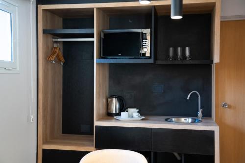 A cozinha ou cozinha compacta de Urbana Suites