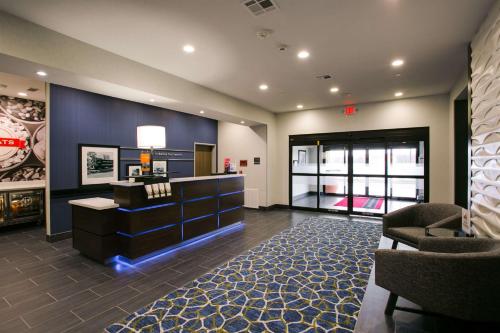 a lobby with a waiting area with a hair salon at Hampton Inn & Suites Dallas/Ft. Worth Airport South in Euless