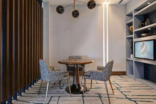 a dining room with a table and chairs at Homewood Suites by Hilton Dallas The Colony in The Colony