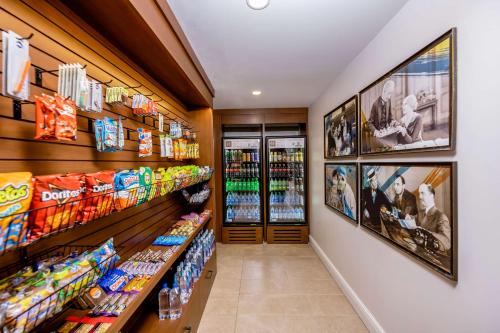 a aisle of a store with drinks and snacks at Hotel Fort Des Moines, Curio Collection By Hilton in Des Moines