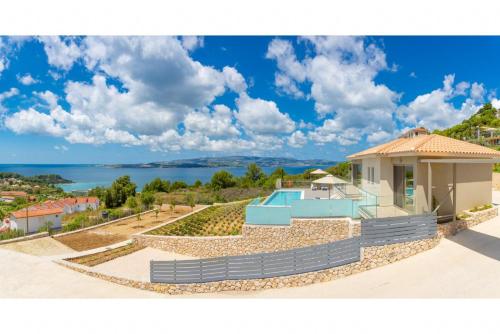 a house with a view of the ocean at Villa Lassi Fos in Lassi