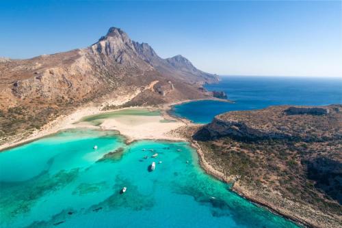 an aerial view of a beach with boats in the water at Villa Konstantina in Exopoli